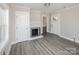 Living room featuring light gray walls and flooring with heater at 801 Requa Rd, Cherryville, NC 28021