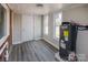 Utility room featuring whitewashed ceiling, brick detail, and modern water heater at 801 Requa Rd, Cherryville, NC 28021