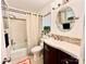 Bathroom featuring a round mirror, ceramic tile flooring, and a shower-tub combination at 9009 Cebu Ct, Fort Mill, SC 29708