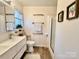 Clean, well-lit bathroom with modern vanity, framed prints, and a glass-enclosed shower at 9009 Cebu Ct, Fort Mill, SC 29708