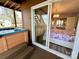 Hot tub and bedroom view through the sliding glass door offer luxury and relaxation at 9009 Cebu Ct, Fort Mill, SC 29708