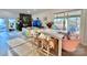 Dining room with a white table, seating for six, and large windows with natural light at 9009 Cebu Ct, Fort Mill, SC 29708