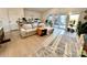 Bright living room filled with plants, natural light, and a comfortable seating area at 9009 Cebu Ct, Fort Mill, SC 29708