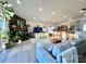 Open-concept living room with fireplace, a play area and seamless access to the kitchen and dining space at 9009 Cebu Ct, Fort Mill, SC 29708