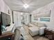 Comfortable living room featuring a sofa, workspace, and mirrored closet doors at 9009 Cebu Ct, Fort Mill, SC 29708