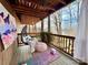 Cozy screened porch features a cushioned egg chair and a yoga mat at 9009 Cebu Ct, Fort Mill, SC 29708
