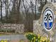 Welcome to Badin Shores Resort, featuring an attractive stone sign and a beautiful landscaped entrance at 103 Dogwood Cir, New London, NC 28127