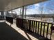 View from the covered deck showing the waterfront and community boat docks at 103 Dogwood Cir, New London, NC 28127