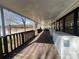 Spacious covered deck with view of waterfront, long layout with chest freezers at 103 Dogwood Cir, New London, NC 28127
