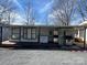 Home's exterior featuring an attached deck and ice storage at 103 Dogwood Cir, New London, NC 28127