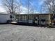 Home's exterior featuring an attached deck and ice storage at 103 Dogwood Cir, New London, NC 28127