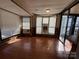 Living room with lots of natural light from windows and a sliding glass door at 103 Dogwood Cir, New London, NC 28127