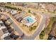 Aerial view of a community pool and playground; perfect for leisure and Gathering fun in the neighborhood at 11502 Wilson Mill Ln, Pineville, NC 28134