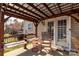 Cozy backyard patio with a wooden pergola, perfect for outdoor relaxation and entertaining guests at 11502 Wilson Mill Ln, Pineville, NC 28134