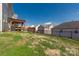 Expansive backyard with a lush lawn and a charming wooden pergola for outdoor entertaining and relaxation at 11502 Wilson Mill Ln, Pineville, NC 28134