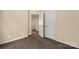 Carpeted bedroom showcasing multiple closets and neutral paint at 11502 Wilson Mill Ln, Pineville, NC 28134