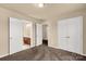 Bedroom with carpet, a closet, and access to an ensuite bathroom at 11502 Wilson Mill Ln, Pineville, NC 28134