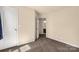 Bedroom featuring neutral walls and carpet with an open doorway to a bathroom at 11502 Wilson Mill Ln, Pineville, NC 28134