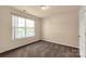 Carpeted bedroom includes one window, neutral paint, and a closet at 11502 Wilson Mill Ln, Pineville, NC 28134