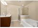 This bathroom has a walk-in shower, large soaking tub, and tile floors at 11502 Wilson Mill Ln, Pineville, NC 28134