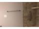 Bathroom features a tiled shower with a built-in shelf and a shower head with a handheld wand at 1220 Avalon Pl, Matthews, NC 28104