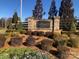 Community entrance sign with beautiful landscaping and stone accents at 1220 Avalon Pl, Matthews, NC 28104