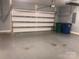 Spacious garage with white door, featuring plenty of space for vehicles and storage at 1220 Avalon Pl, Matthews, NC 28104