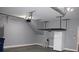 An attached garage with overhead storage racks and space for parking or storage at 1220 Avalon Pl, Matthews, NC 28104