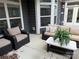 Cozy patio space with comfortable seating and a stylish coffee table at 1220 Avalon Pl, Matthews, NC 28104