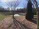 Scenic pond with a fountain and a black fence outlining the yard at 1220 Avalon Pl, Matthews, NC 28104