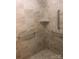 The tiled shower features built in shelf and grab bars at 1220 Avalon Pl, Matthews, NC 28104