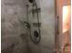 The accessible shower features neutral tile, shower caddy, and grab bars at 1220 Avalon Pl, Matthews, NC 28104