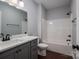 The new bathroom features a modern vanity, quartz countertop, and tub and shower combo at 1282 Beal Rd, Lincolnton, NC 28092