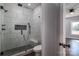 Modern bathroom with tiled shower featuring a built-in niche and glass door at 1282 Beal Rd, Lincolnton, NC 28092