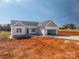 New construction featuring an inviting open garage, lawn and a charming exterior at 1282 Beal Rd, Lincolnton, NC 28092