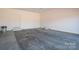 A spacious garage with sealed floors, a garage door, and ample room for storage at 1282 Beal Rd, Lincolnton, NC 28092