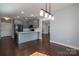 An open kitchen with gray cabinets and a dark hardwood floor at 1282 Beal Rd, Lincolnton, NC 28092