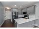 A modern kitchen with gray cabinets, white subway tile, and a large stainless steel refrigerator at 1282 Beal Rd, Lincolnton, NC 28092