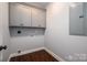 The laundry room boasts ample cabinet space and modern vinyl flooring at 1282 Beal Rd, Lincolnton, NC 28092