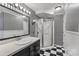 Stylish bathroom featuring black-and-white striped walls and a glass-enclosed shower at 130 Ketchie Dr, Mooresville, NC 28115