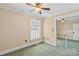 Cozy bedroom with a ceiling fan, window with blinds and mirrored closet doors at 130 Ketchie Dr, Mooresville, NC 28115
