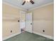Bedroom showcasing an open door and neutral walls with carpet flooring at 130 Ketchie Dr, Mooresville, NC 28115