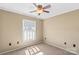 Bedroom features a ceiling fan, window with blinds and carpet flooring at 130 Ketchie Dr, Mooresville, NC 28115