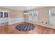 Inviting dining area with hardwood floors, wainscoting, and a decorative chandelier at 130 Ketchie Dr, Mooresville, NC 28115