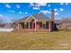 Traditional one-story brick home with a bright red door and a neatly kept front yard at 130 Ketchie Dr, Mooresville, NC 28115