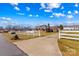 Inviting single story brick home featuring a well-manicured lawn, and a white fence offering curb appeal at 130 Ketchie Dr, Mooresville, NC 28115