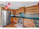 The kitchen is equipped with stainless steel appliances, wooden cabinets, and updated features at 130 Ketchie Dr, Mooresville, NC 28115