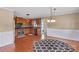 Open kitchen featuring wooden cabinetry and modern appliances next to a spacious dining area at 130 Ketchie Dr, Mooresville, NC 28115