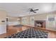 Cozy living room with a brick fireplace, hardwood floors, and ample natural light at 130 Ketchie Dr, Mooresville, NC 28115