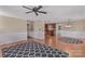 Bright living room with hardwood floors, a ceiling fan, and views into the kitchen at 130 Ketchie Dr, Mooresville, NC 28115